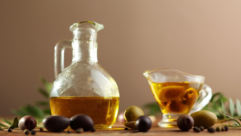 A,Beautifully,Arranged,Olive,Oil,Bottle,Alongside,Fresh,Olives,And